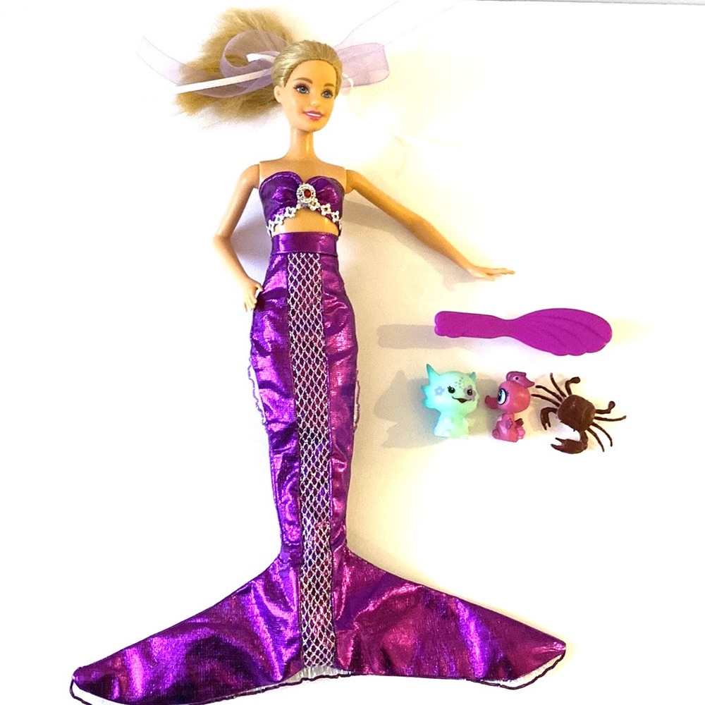 Barbie doll wearing mermaid fin and bikini top